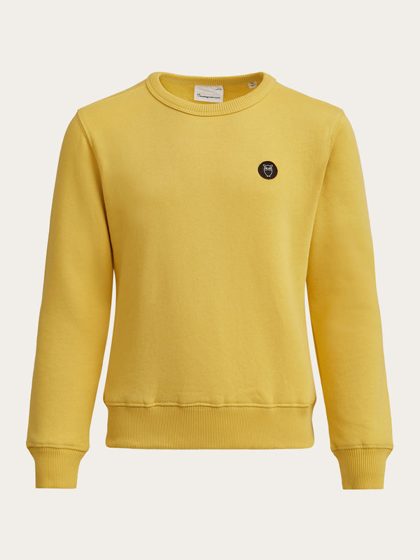 KnowledgeCotton Apparel - YOUNG Badge crew neck sweat Sweats 1429 Misted Yellow