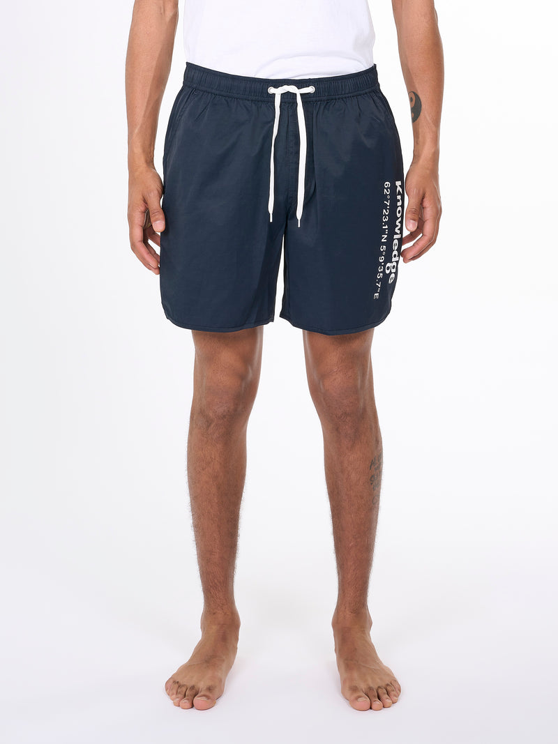 KnowledgeCotton Apparel - MEN Swim shorts with elastic waist and Knowledge print Swimshorts 1001 Total Eclipse